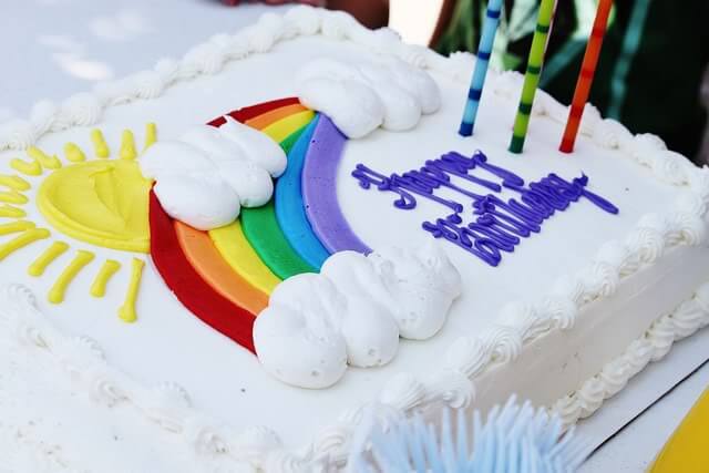 costco rainbow birthday cake with 3 candles