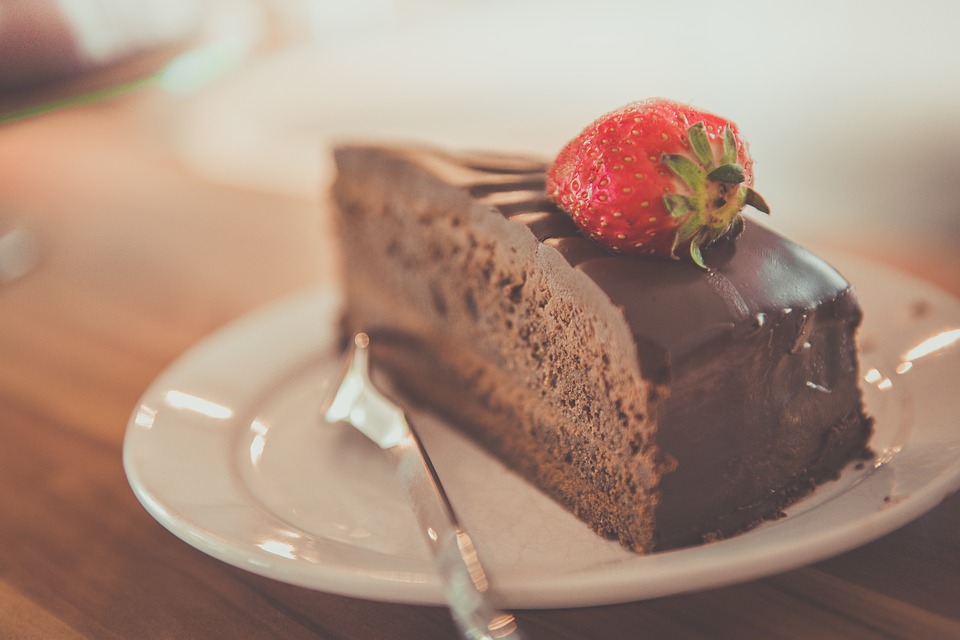 Strawberry on top of ultimate chocolate cake