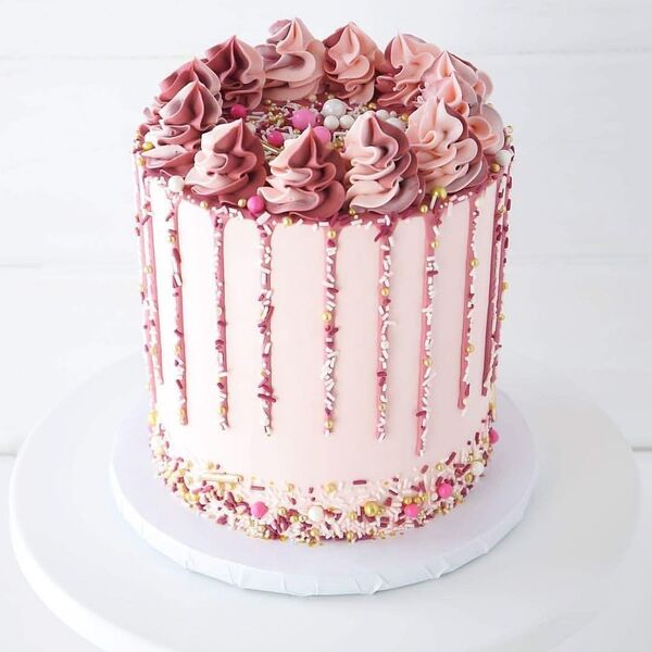 pink cake with colorful sprinkles